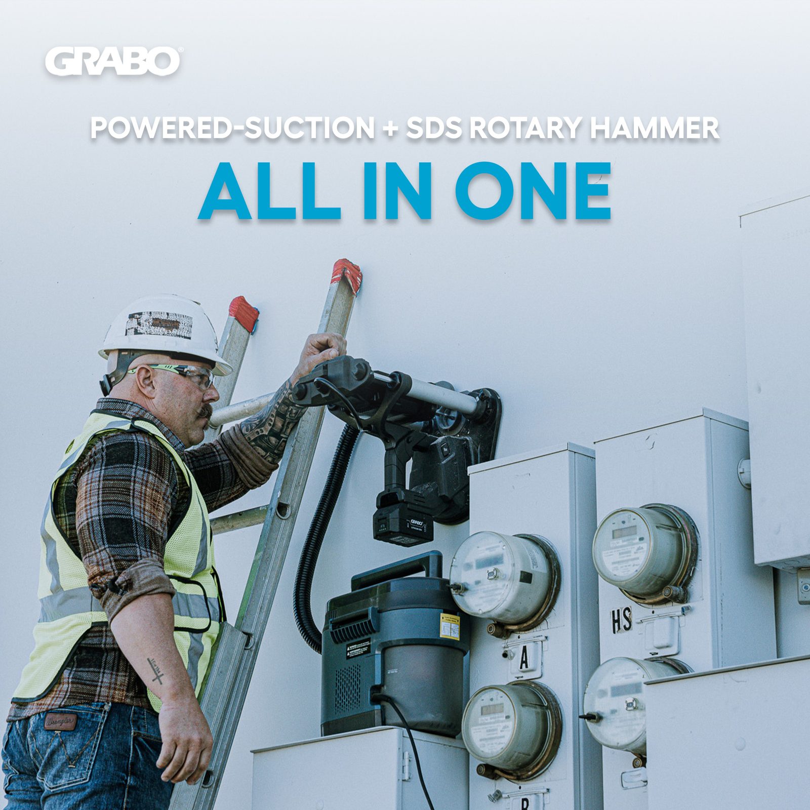 Electrician using the GRABO powered-suction SDS rotary hammer anchored to a wall
